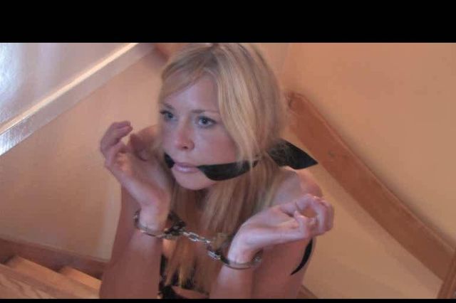 PAULA HANDCUFFED AND CLEAVE GAGGED IN THE STAIRS